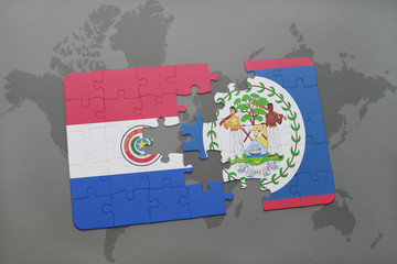 puzzle with the national flag of paraguay and belize on a world map background.
