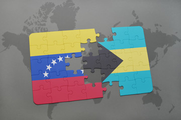 puzzle with the national flag of venezuela and bahamas on a world map background.