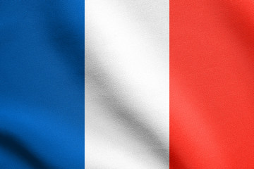 Flag of France waving in wind with fabric texture
