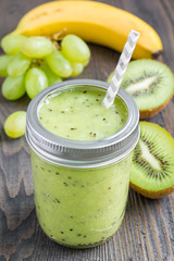 Healthy smoothie with kiwi, green grape, and banana in jars