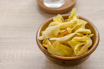 Durian chips fried snack fruit in brown blow on wooden backgroun