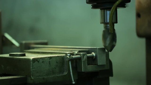 Process of grinding metal parts end mill on a horizontal machine.