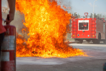 Firefighter fighting fire during training