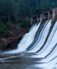 Water flowing down the walls of the old small hydropower plants