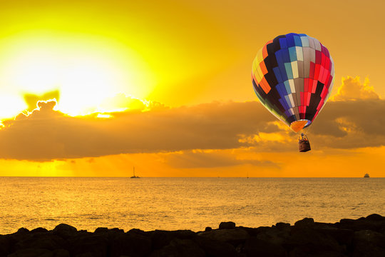 Hot air balloon at sunset beach