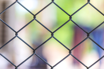 Fototapeta premium Wire mesh fence. Close up.