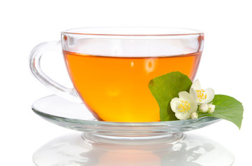 Glass cup of tea with jasmine on the white background