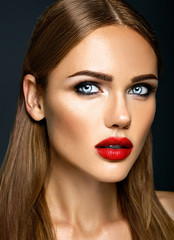 Fototapeta premium sensual glamour portrait of beautiful woman model lady with fresh daily makeup with red lips color and clean healthy skin face