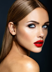 Fototapeta premium sensual glamour portrait of beautiful woman model lady with fresh daily makeup with red lips color and clean healthy skin face