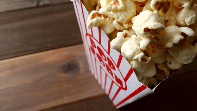 4K: Popcorn In Box Spins Into Camera View