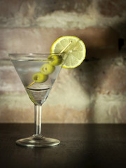 Martini with olives, lemon and ice