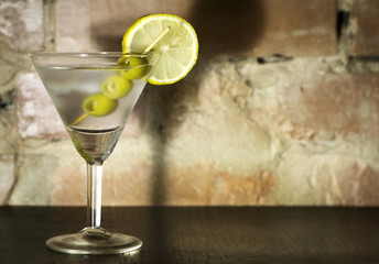 Martini with olives, lemon and ice