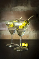 Martini with olives, lemon and ice