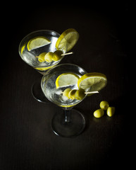 Martini with olives, lemon and ice