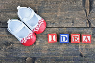 Kid shoes and word Idea