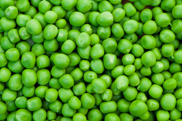 Fresh green peas background texture top view