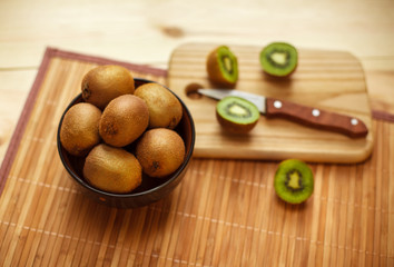 Still life. Tropical fruit. Juicy kiwi on the wooden table