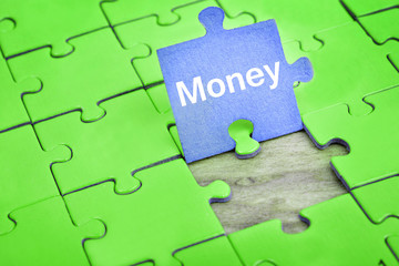 Fototapeta premium Puzzle with word Money