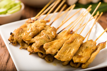 Pork satay,Grilled pork set on wood table , thai style