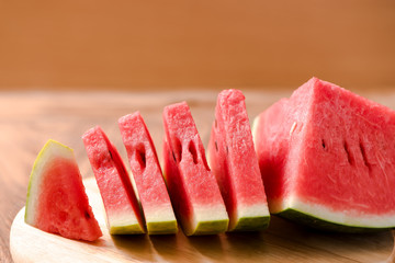slices of watermelon on wood table,wood background