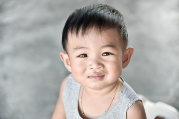 Asian baby boy feeling happy and smile
