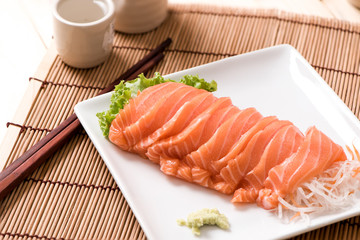 Salmon Sashimi in plate on wood table , japan food