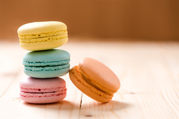 Macaron in plate on wood table