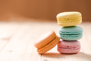 Macaron in plate on wood table