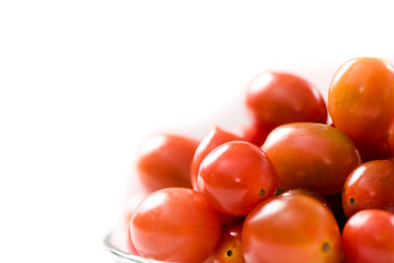 Cherry tomatoe in plate on white background
