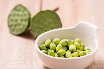 lotus seeds on wood background
