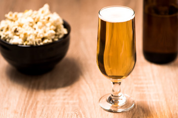 beer in glass on wood table