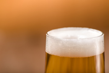 beer in glass on wood table