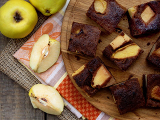 quince slices of chocolate cake on a wooden board