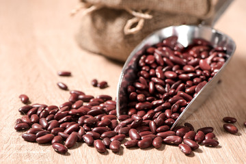 Kidney bean,Red beans in metal scoop on wood table