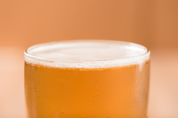 Beer in glass,on wood background