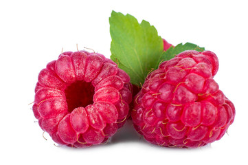 Ripe red raspberries with leaves isolated on white background