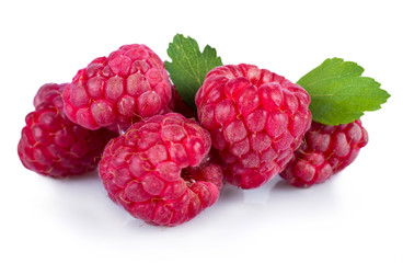 Ripe red raspberries with leaves isolated on white background