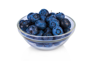 Fresh blueberries in a jar on a white background