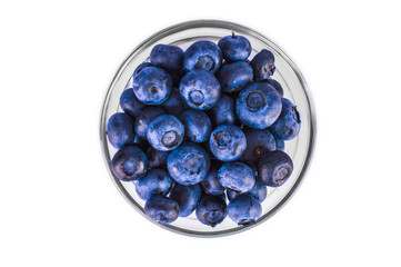 Fresh blueberries in a jar on a white background