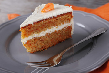 Piece of carrot cake on plate, closeup