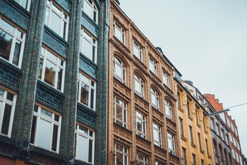 Fototapeta na wymiar Rows of urban apartments with various exteriors