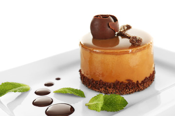Caramel cake on light background