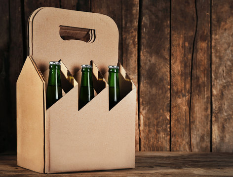 Paper beer package  on wooden background