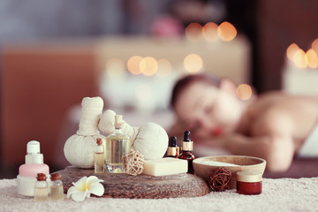 Spa composition and girl on blurred background