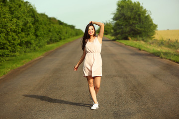 Fototapeta premium Beautiful girl on road