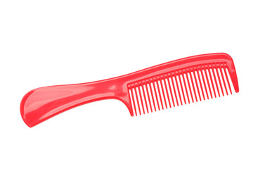 Red plastic comb isolated on white