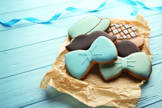 Tasty cookies on blue wooden background