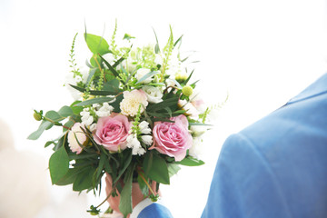 Groom with beautiful bouquet, closeup
