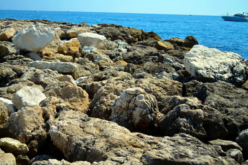 rocky coast at french riviera with blue water