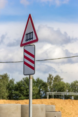 Road sign heralding the railway crossing